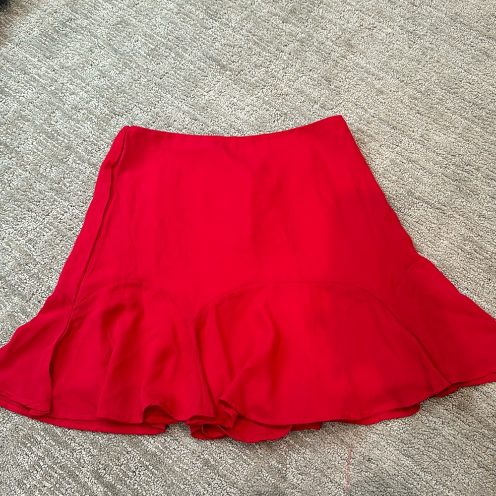 Red Francesca’s Rixxi Collection mini fluted skirt. Size medium, never worn.